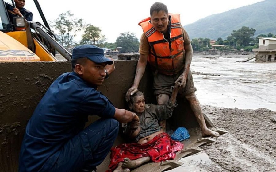 People pulled from mud in Nepal after deadly flash floods
