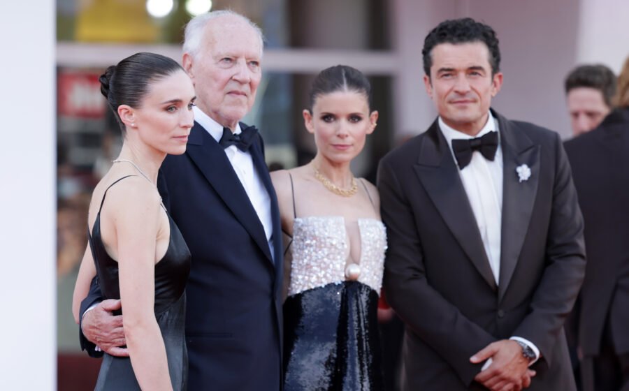 Werner Herzog and Orlando Bloom on ‘Bucking Fastard’ and That Threesome Scene With the Mara Sisters: ‘It Has Such Charm and Depth’