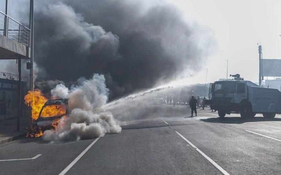 Cars torched and shops looted as anti-migrant violence erupts in South Africa