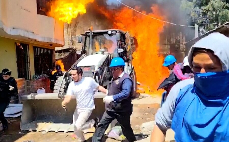 Residents douse workers with flaming gasoline during eviction in Peru