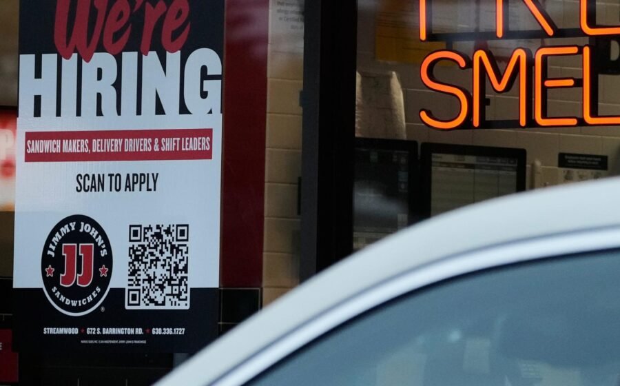 Americans filing for jobless aid remain at historically low levels below 200,000
